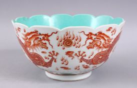 A CHINESE IRON RED & TURQUOISE PORCELAIN MOULDED BOWL, with iron red decorated dragons with green