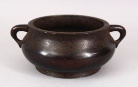 A CHINESE MING STYLE BRONZE TWIN HANDLES CENSER, the base with an impressed mark, 22cm.