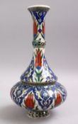 AN ISLAMIC PALESTINIAN POTTERY WATER URN, decorated with floral decoration, 31cm