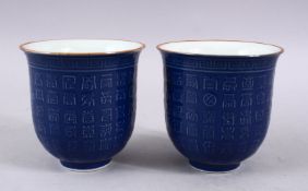 A PAIR OF CHINESE POWDER BLUE YONGZHENG STYLE PORCELAIN CALLIGRAPHIC BEAKERS, 9.3CM.