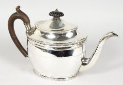 A GEORGE III OVAL TEAPOT, with ebony finial and handle. London 1803. Maker: Daniel Piers.