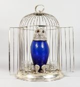 A NOVELTY PLATED BIRD CAGE DECANTER SET, with a decanter in the form of an owl. 18ins high.
