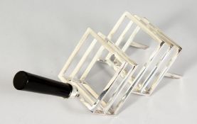 A CHRISTOPHER DRESSER DESIGN TOAST RACK with ebony handle.