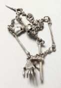 A SILVER SKULL WATCH CHAIN.