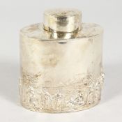 AN OVAL TEA CADDY AND STOPPER, repousse with a Dutch scene. Chester 1902.