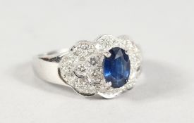A GOOD 18CT GOLD, DIAMOND AND SAPPHIRE RING.