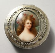 A GOOD CONTINENTAL SILVER CIRCULAR BOX, the hinged lid inset with a painted porcelain plaque of a