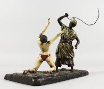 A VIENNA STYLE COLD PAINTED BRONZE OF AN ARAB AND FEMALE NUDE. 7ins long.