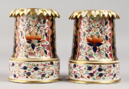 AN UNUSUAL PAIR OF 19TH CENTURY DERBY VASES, painted and gilded in Imari style.