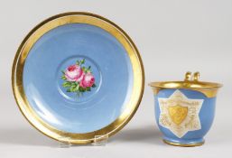 A GOOD VIENNA CUP AND SAUCER, blue ground edged in gilt, crest and flowers. Beehive mark in blue.