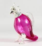 A PARROT SHAPED CLARET JUG, with plated head and feet, cranberry colour glass body. 6ins high.