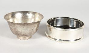 A SWEDISH HAMMERED SILVER BOWL, 4ins diameter, and A WINE COASTER (2).