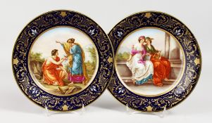 A GOOD PAIR OF 19TH CENTURY VIENNA PLATES, rich blue and gilt ground, with classical scenes.