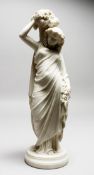 A 19TH CENTURY PARIAN CLASSICAL FEMALE FIGURE, with baskets of grapes. 14ins high.