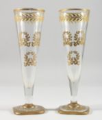 A SIMILAR PAIR OF BACARAT GLUTED DECANTERS AND STOPPERS.
