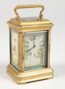 A MINIATURE BRASS CARRIAGE CLOCK, with Sevres style porcelain panels. 3ins high.