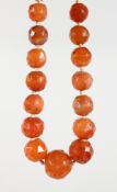 A FACETED CARNELIAN BEAD NECKLACE.