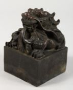 A LARGE CHINESE BRONZE DRAGON SEAL. 3.5ins wide.