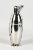 A SILVER PLATE PENGUIN COCKTAIL SHAKER.