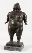 A BRONZE STANDING FEMALE NUDE, on a marble base. 14.5ins high.