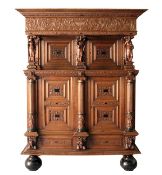 A GOOD 17TH CENTURY FLEMISH OAK CUPBOARD, with carved cornice and frieze, carved with a vase and