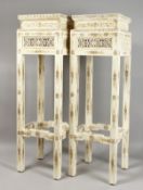 AN UNUSUAL PAIR OF CHINESE BONE PEDESTAL STANDS, with carved and pierced decoration. 41.5ins high