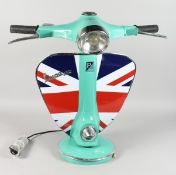 A LARGE TABLE LAMP MODELLED AS THE FRONT END OF A VESPA SCOOTER. 25ins high.