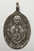 A RUSSIAN SILVER OVAL ICON PENDANT. 2ins high.