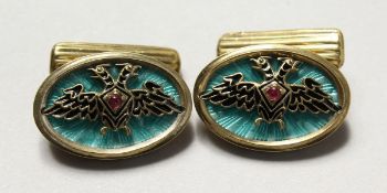 A PAIR OF MODERN RUSSIAN SILVER AND ENAMEL DECORATED DOUBLE EAGLE CUFFLINKS.
