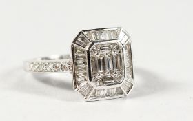 A GOOD 18CT GOLD DECO DESIGN DIAMOND AND BAGUETTE DIAMOND RING.