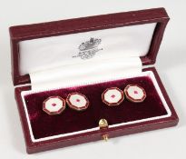 A PAIR OF ASPREY 9CT GOLD, RUBY AND MOTHER-OF-PEARL OCTAGONAL SHAPED CUFFLINKS, in an Asprey leather