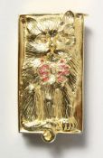 A SILVER AND GOLD PLATED CAT VESTA set with rubies and diamonds.