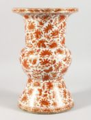 A CHINESE PORCELAIN BALUSTER SHAPED VASE, painted with orange and gilt flowers. 13is high.