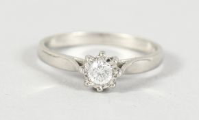 AN 18CT WHITE GOLD SOLITAIRE DIAMOND RING.