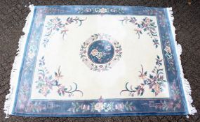 A GOOD LARGE MODERN CHINESE CARPET, beige ground with central floral motif within a similarly