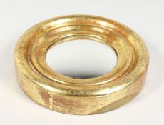 A MINIATURE GILT WOOD CIRCULAR CONVEX MIRROR. 7.5ins diameter.