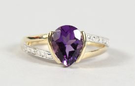 A 9CT GOLD PEAR SHAPED AMETHYST AND DIAMOND RING.