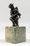 AFTER GIAMBOLOGNA A GOOD SMALL BRONZE OF A MAN PLAYING BAGPIPES. 3ins high, on a square marble
