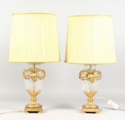 A GOOD PAIR OF ORMOLU AND CUT GLASS VASE SHAPED TABLE LAMPS, with satyr mask handles. 14ins high.