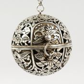 A CHINESE PIERCED SILVER BALL SHAPE CENSER. 2.25ins diameter.