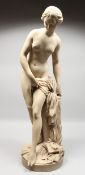 AFTER ETIENNE-MAURICE FALCONET A STANDING FIGURE OF VENUS, on a circular base. Signed FALCONET