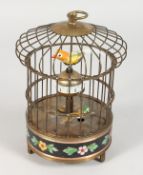 A NOVELTY BIRD CAGE CLOCK. 8ins high.