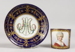 A GOOD SEVRES CUP AND SAUCERS, rich blue ground, portrait of Md. Necker. Mark in blue, Letter K.