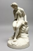 A 19TH CENTURY PARIAN MODEL OF A FEMALE NUDE, sitting on a rock. 10ins high.