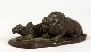 A SMALL JAPANESE BRONZE MODEL OF A LION AND LIONESS. 4ins long.