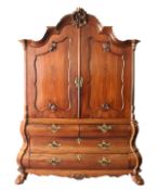 AN 18TH CENTURY DUTCH MAHOGANY BOMBE CUPBOARD, with shell carved arched cornice, pair of panelled
