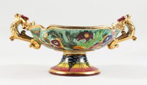 AN UNUSUAL 1960'S MONACO PORCELAIN TWO-HANDLED COMPORT, edged in gilt with fish decoration. 8ins