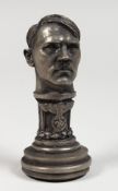 A CAST METAL DESK SEAL OF ADOLF HITLER. 3ins high.