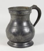 A LARGE EARLY PEWTER HALF GALLON MEASURE, stamped Gallon. 7.5ins high.