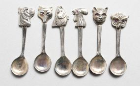 A SET OF SIX SILVER ANIMAL HEAD SPOONS.